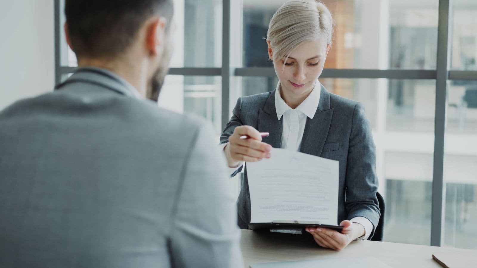Illustrative photo of a written proposal being reviewed together